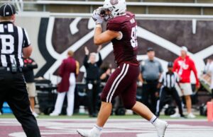 Transferência de futebol de Wisconsin apertada e Lance Mason Date