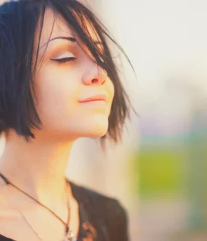 calm-relaxed-young-woman-sunset.webp.webp