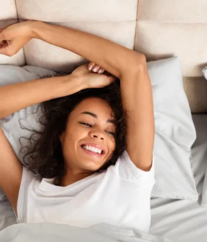happy-young-woman-waking-up-rested.webp.webp