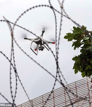94862831-15260289-A_drone_hovers_over_a_prison_fence_The_devices_are_being_used_to-a-2_1762336697487.avif
