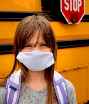 girl-child-covid-mask-school-bus.webp.webp