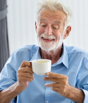 happy-elderly-man-tea.webp.webp