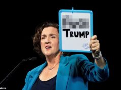 O polêmico candidato a governador provocou indignação depois de erguer um cartaz altamente ofensivo enquanto denunciava Trump