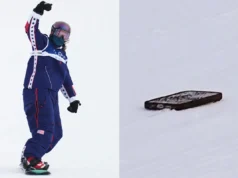 A snowboarder da equipe dos EUA, Jessica Perlmutter, deixa cair o telefone no ar com o fio do fone de ouvido nas Olimpíadas