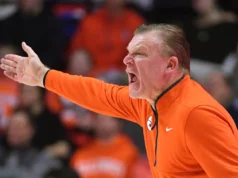 Wisconsin se recuperou para surpreender o número 8 de Illinois na prorrogação pela última vitória na estrada.