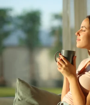 woman-enjoying-morning-coffee-and-sunshine.webp.webp