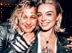 A polícia prendeu o roqueiro australiano e sua namorada depois de fazerem uma descoberta surpreendente atrás de uma parede secreta em seu estúdio.