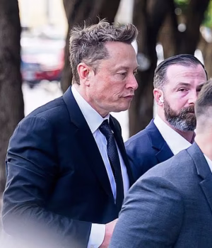 107310525-15666529-Elon_Musk_pictured_entering_federal_court_on_March_4_was_found_l-a-11_17740696684.avif
