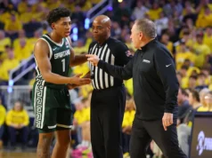 Jeremy Elliott, do Michigan State, leva um susto pelo chute na virilha de Cadeau enquanto Michigan vence o rival