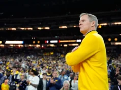 Que bônus Dusty May recebeu por levar Michigan ao título nacional?