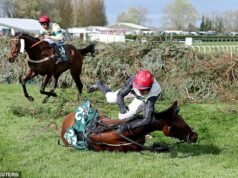 Um jóquei do Grand National foi banido depois de não deixar seu cavalo cansado parar antes de cair na cerca final – enquanto usava um pêlo de carneiro vermelho nas luvas para seu lendário avô.