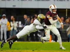 Quem os Cowboys conseguiram com a escolha dos Packers na primeira rodada na troca de Micah Parsons?