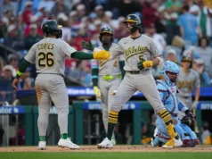 Ginn fez 8 entradas e acertou um dos quatro home run do A na vitória por 12-1 sobre o Guelph Phillies.