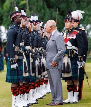 109702617-15942717-The_King_cut_a_dapper_figure_as_he_chatted_to_members_of_the_Roy-a-4_178285546173.avif