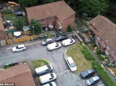 Um homem foi acusado de duplo homicídio depois que uma mulher de 46 anos e um homem de 66 foram encontrados mortos em casa “depois que vizinhos ouviram uma briga”.