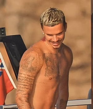 110208193-16000051-Romeo_Beckham_looked_just_like_his_famous_father_David_as_they_s-m-152_1784816281.avif