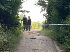 Dois homens foram acusados de assassinato depois que uma mala contendo um corpo foi encontrada dentro de uma família após participar de uma caçada a um ursinho de pelúcia.