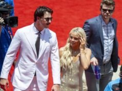 Olivia Dunn faz uma declaração com um visual estiloso enquanto apoia Paul Skeness no MLB All-Star Game
