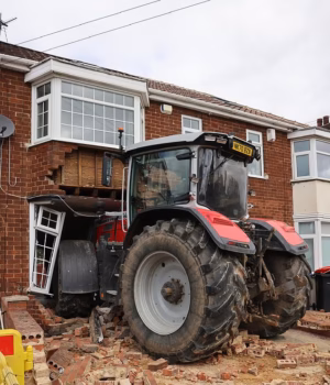 108521975-16043683-A_stolen_tractor_smashed_into_a_house_before_a_masked_gang_fled_-a-1_178643535955.avif