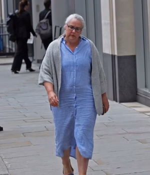 109769979-16081409-Lindsay_Bisiker_50_pictured_outside_High_Court_She_is_suing_her_-a-1_178774710233.avif