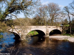 Uma investigação foi iniciada depois que os restos mortais de um feto foram encontrados em um saco debaixo de uma ponte em Lancashire.