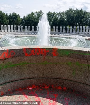 110642911-16053235-Photos_show_hot_red_paint_splattered_over_the_memorial_with_the_-a-22_17867231326.avif