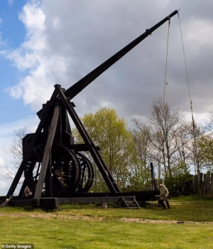 110809195-16074585-A_trebuchet_is_fired_off_at_the_outdoor_Medieval_Centre_on_May_0-m-58_17875307487.avif