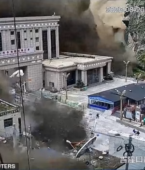 110861209-16081379-CCTV_footage_shows_people_running_away_as_wall_of_mud_and_water_-a-2_178774857538.avif