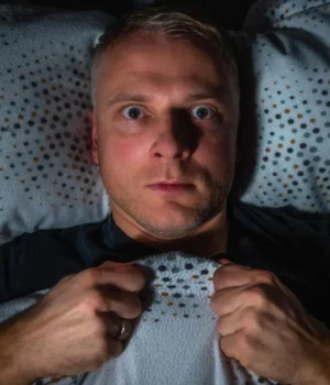 man-scared-in-bed.webp