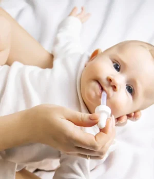 mother-gives-infant-baby-medicine.webp