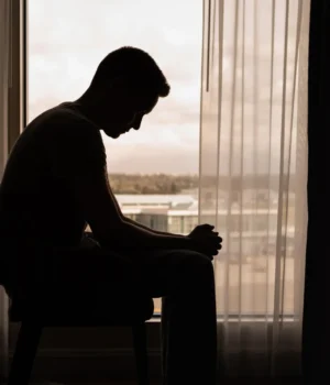sad-lonely-man-in-dark-room.webp