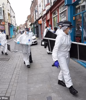 107887705-16139053-Police_forensic_investigators_entering_the_disused_building_in_F-a-8_178964830694.avif
