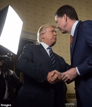 110958769-16093849-President_Donald_Trump_left_shakes_hands_with_then_FBI_Director_-a-1_178820492668.avif