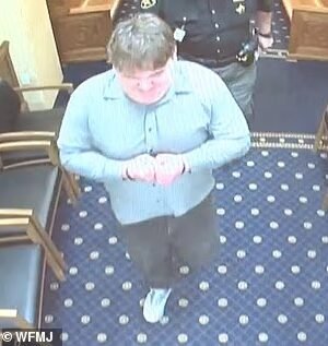 111290567-16136191-Timothy_Reaggle_suddenly_broke_out_of_his_handcuffs-a-26_1789580820666.jpg