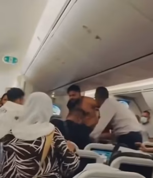111324477-16141379-The_men_grappled_and_struck_each_other_over_seats_as_several_peo-a-12_17897190010.avif