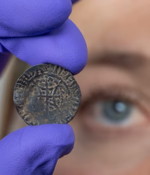 111336677-16142921-Curator_Alice_Blackwell_inspects_the_David_I_penny_thought_to_be-m-11_17897526914.avif
