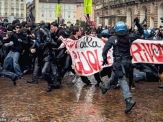 Os motins estudantis na Europa se espalharam pela Itália enquanto manifestantes encapuzados entravam em confronto com a polícia de choque na cidade