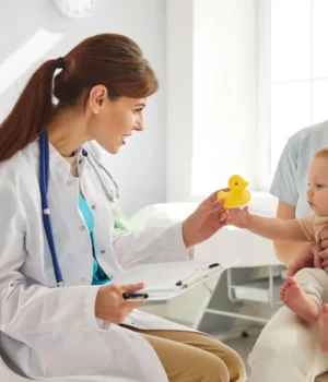 pediatrician-newborn-baby-with-mother.webp