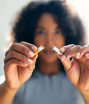woman-breaking-cigarette-close-up.webp